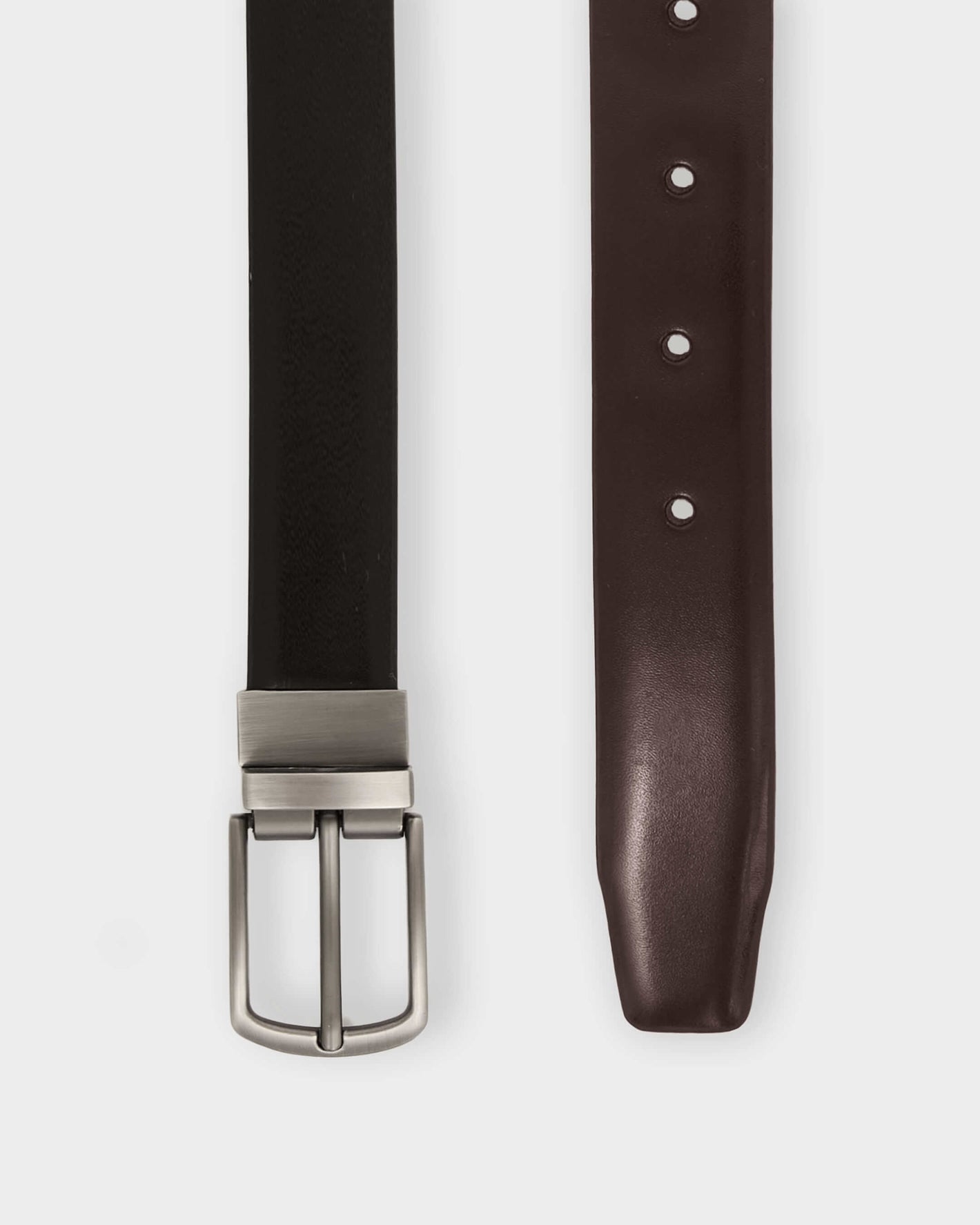 Reversible Dress Belt: black/brown faux leather with brushed-nickel buckle.