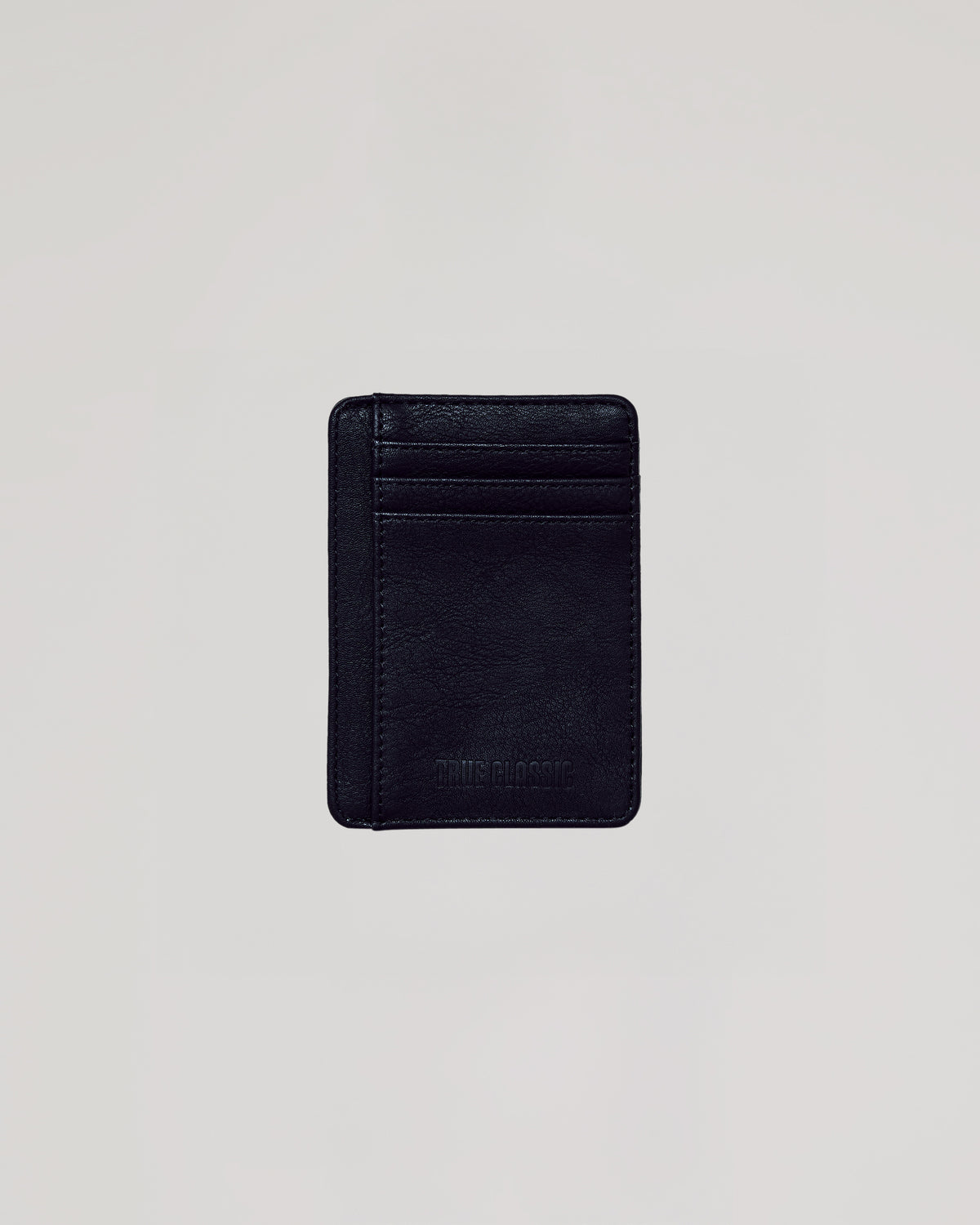 Black Classic Wallet: Slim black vegan leather card-holder with embossed TRUE CLASSIC.