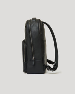 True ClassicPremium Leather Backpack side view with zippered compartments and adjustable straps.