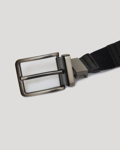 True ClassicCasual Reversible Stretch Belt with metal buckle on black strap.