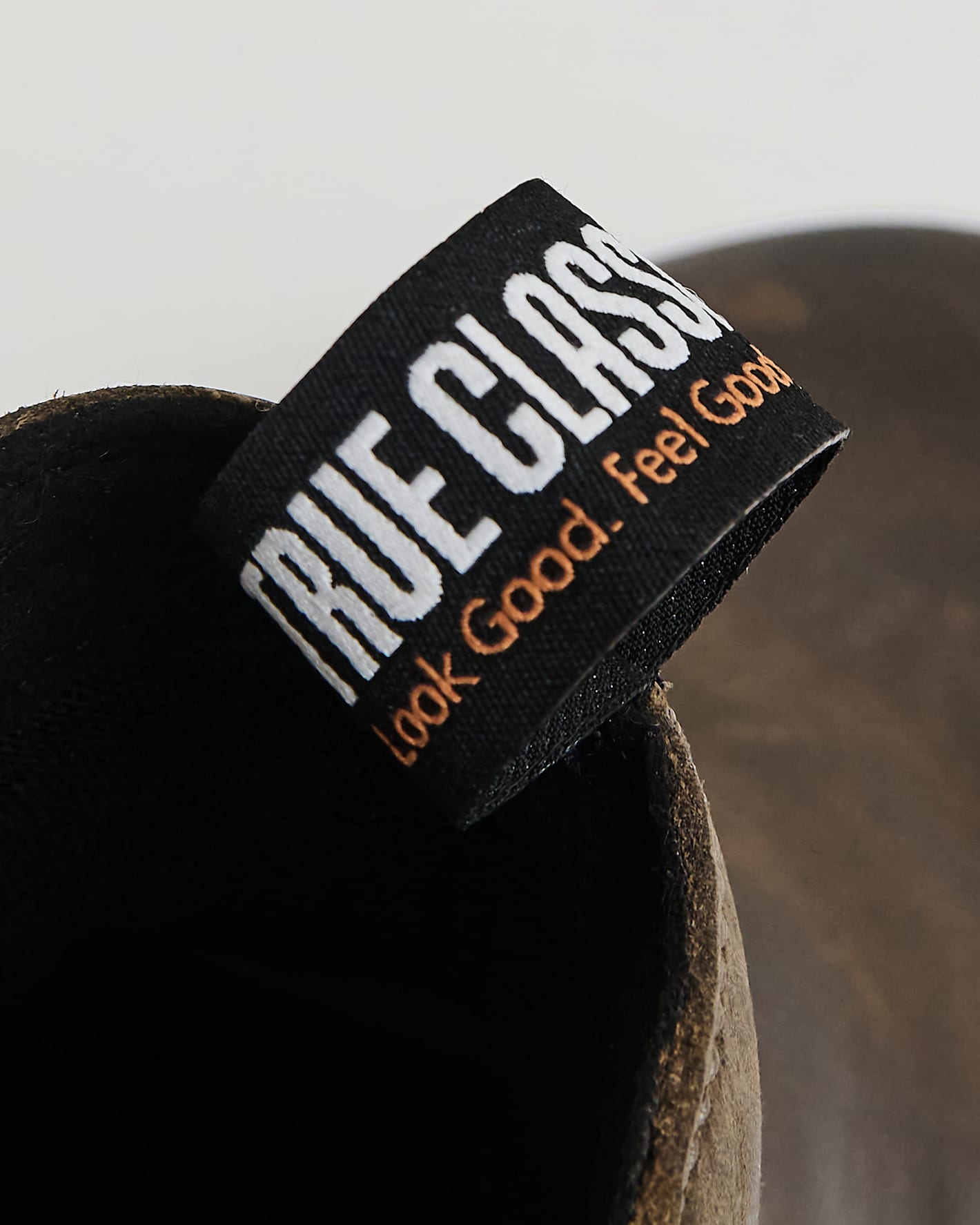True Classic x Timberland Pro Chelsea Boots fabric pull-tab with logo.