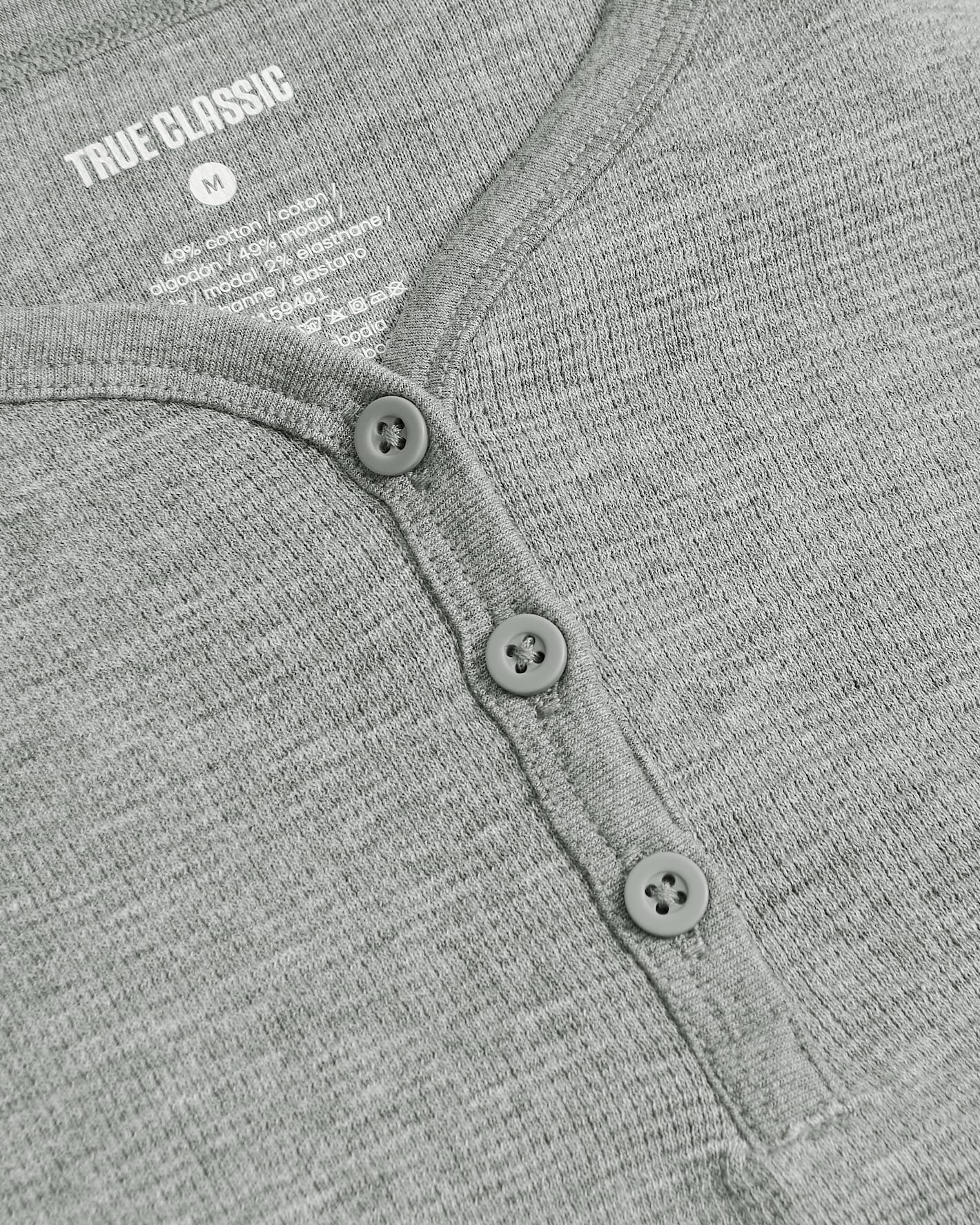 Girls Heather Gray Long Sleeve Boxy Waffle Henley with button-front detail.