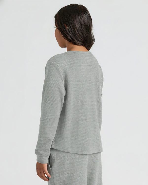 Person wearing Girls Heather Gray Waffle Long Sleeve Henley & Waffle Leg Pants.