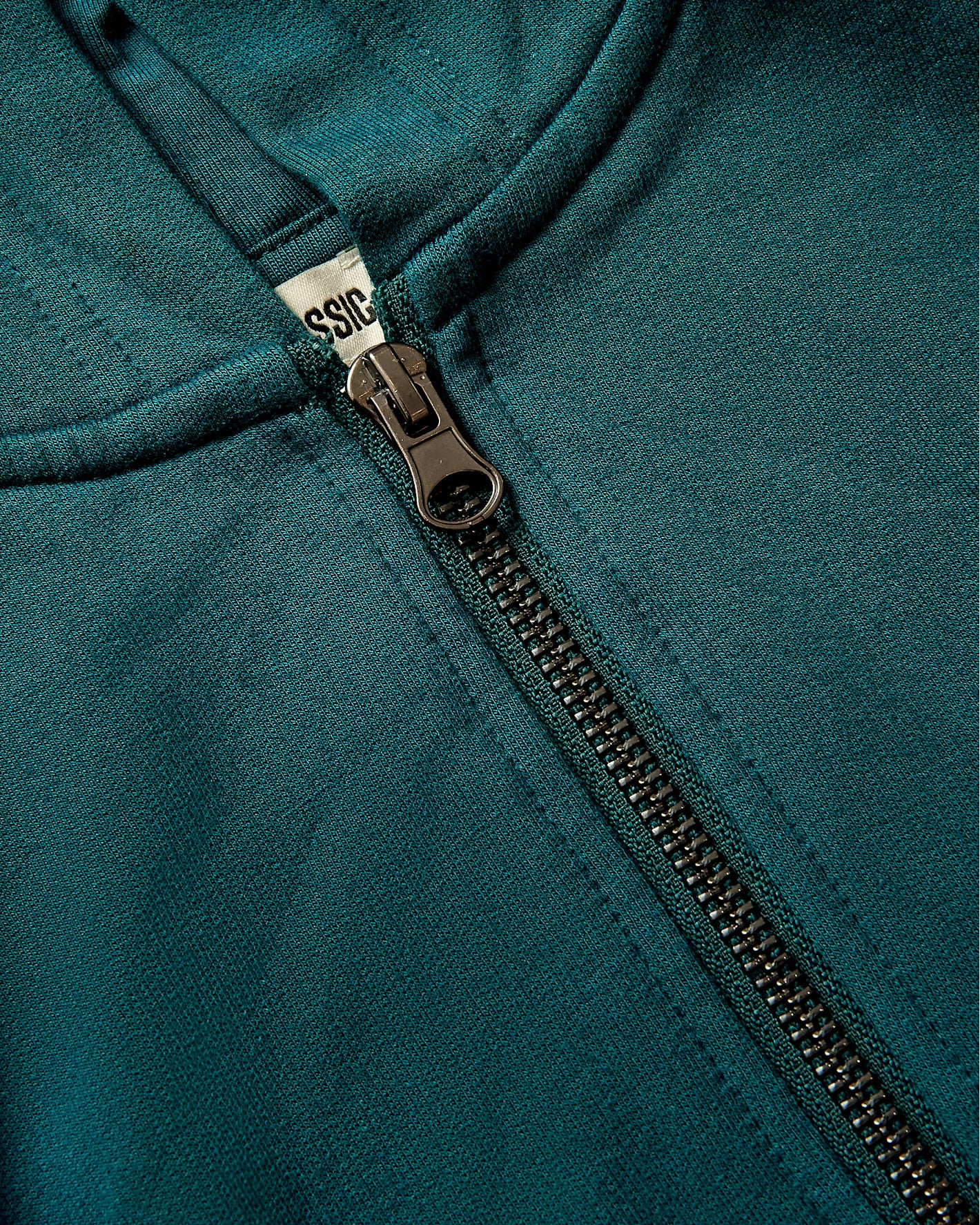 Girls Deep Emerald Cropped Zip Hoodie with visible metal zipper.
