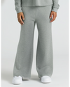 Child wearing Girls Heather Gray Waffle Long Sleeve Henley & Waffle Leg Pants.