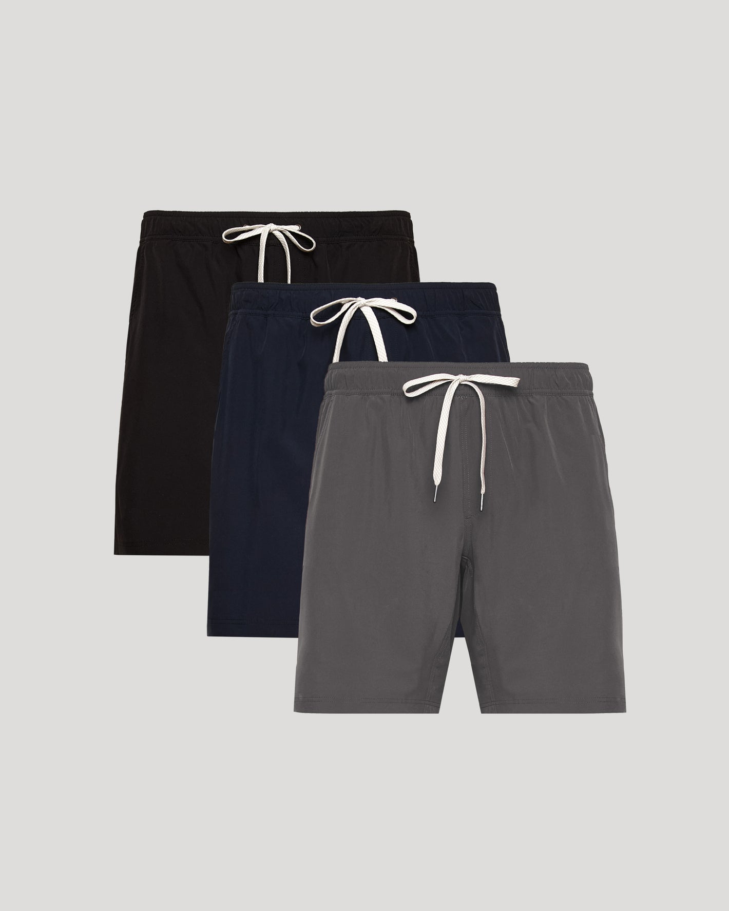 9 Active Quick Dry Shorts 3-Pack with elastic waistbands and drawstrings.