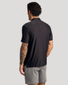 Black Active Polo 6-Pack on man, showcasing back view and tattooed arm.
