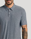 Man in Heather Gray Short Sleeve Active Polo with tattooed forearm visible.