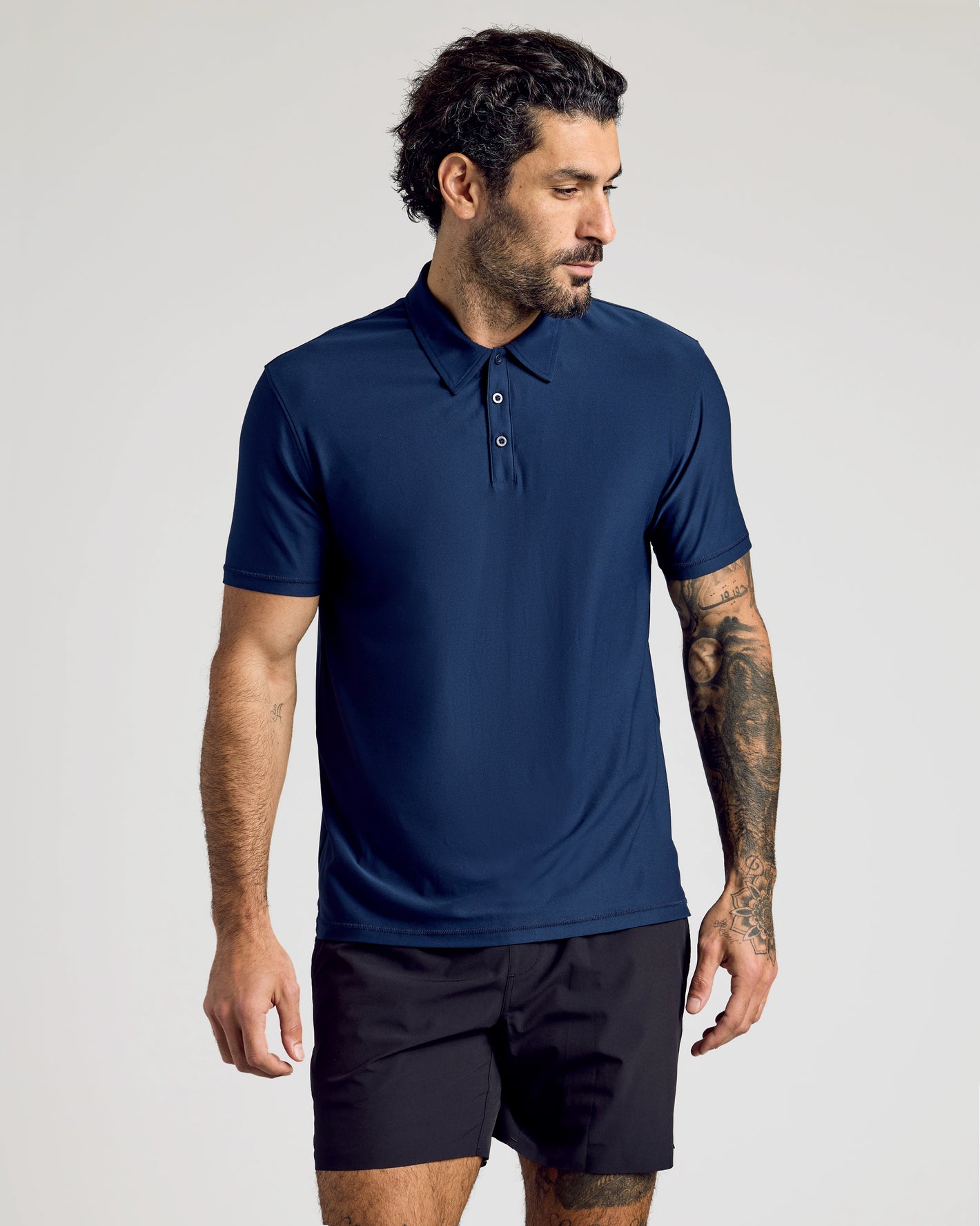 Male model in Active Short Sleeve Polo 3-Pack, navy version.