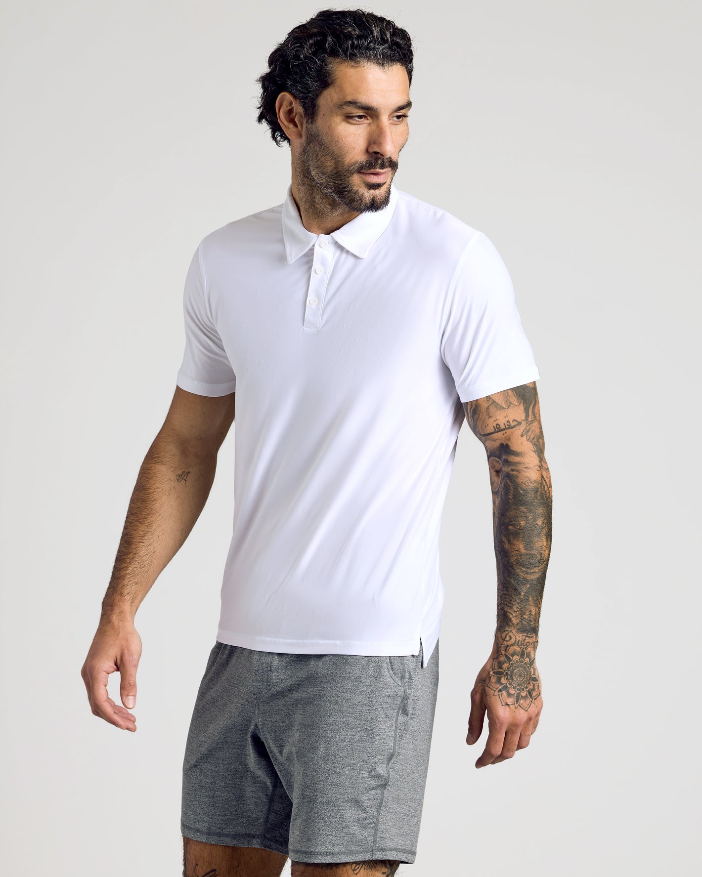 Male model wearing the Active Short Sleeve Polo, showcasing casual athleisure style.