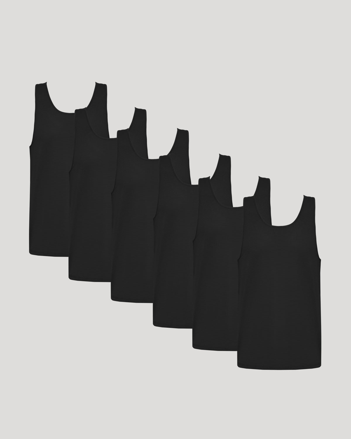 Men's Sleeveless Active Mesh Performance Tank Tops arranged in a staggered diagonal row.
