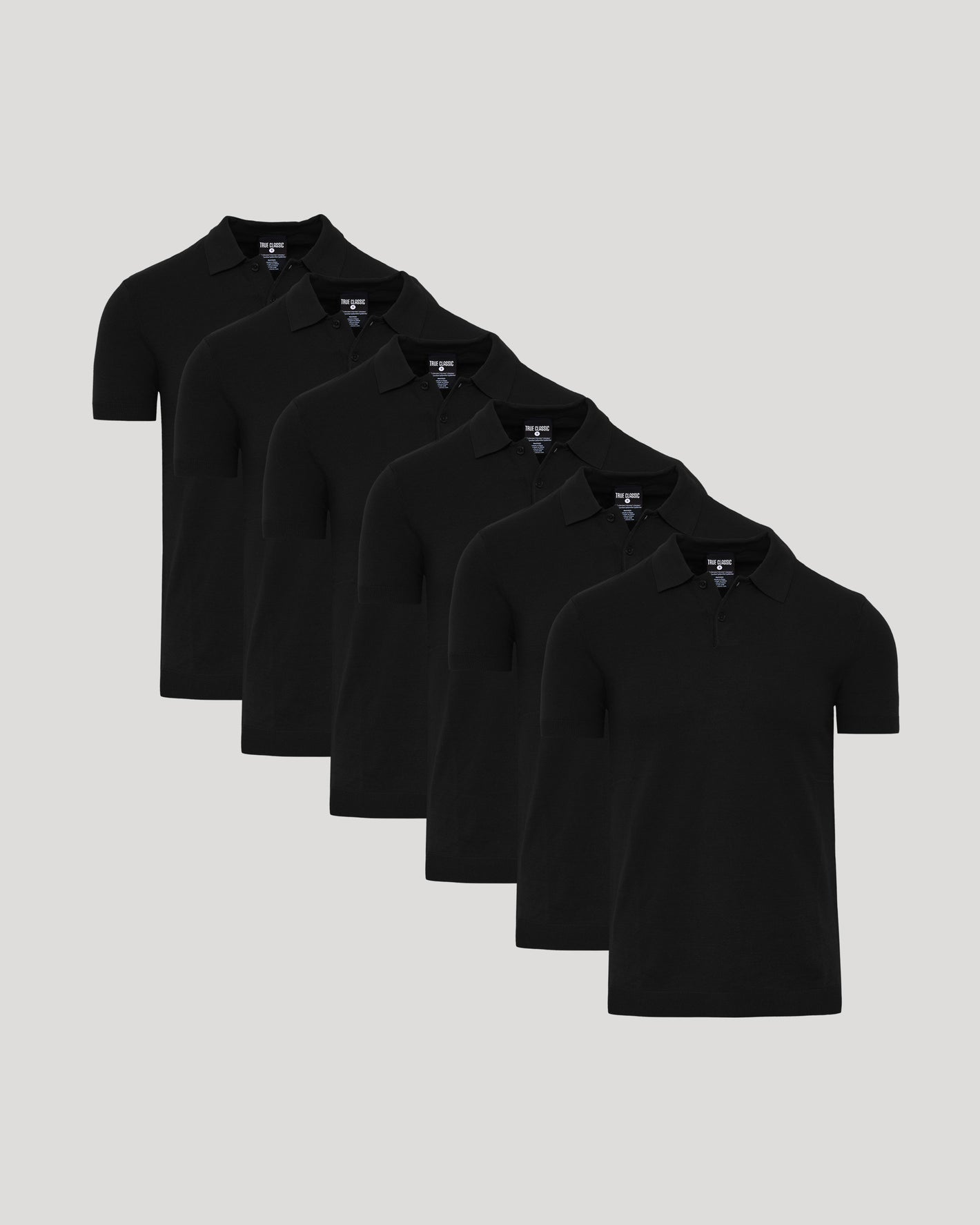 Black Dressy Polo 6-Pack arranged in staggered line, showcasing sleek design.