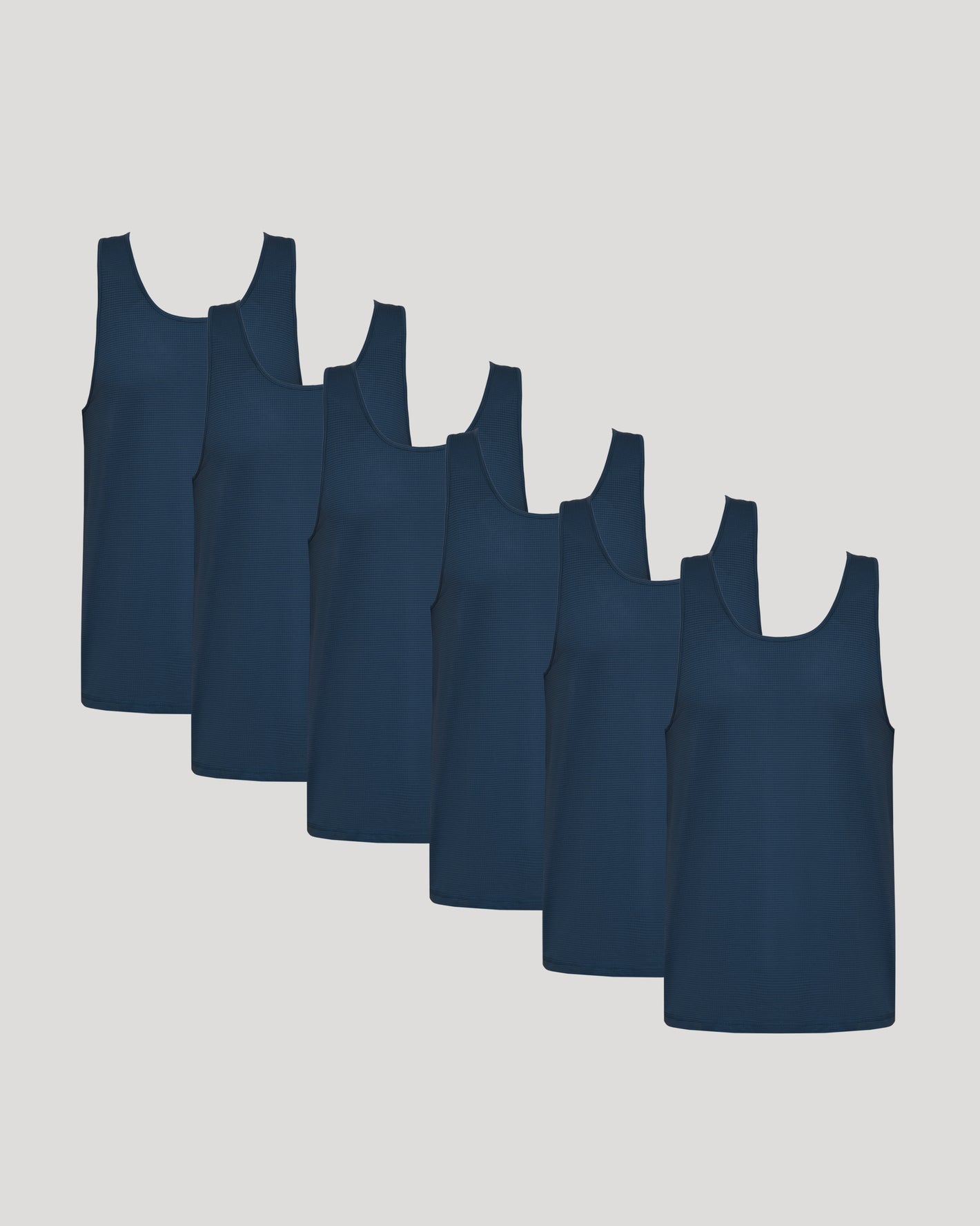 All Navy Active Mesh Tank 6-Pack arranged in a staggered row.