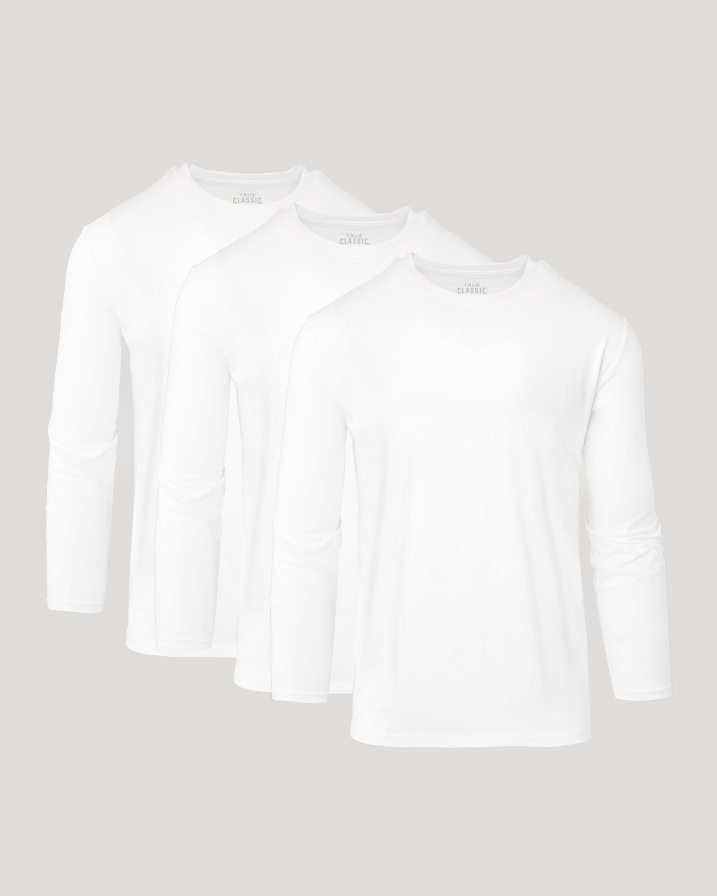 All White Active Long Sleeve Crew 3-Pack overlapping on gray background.
