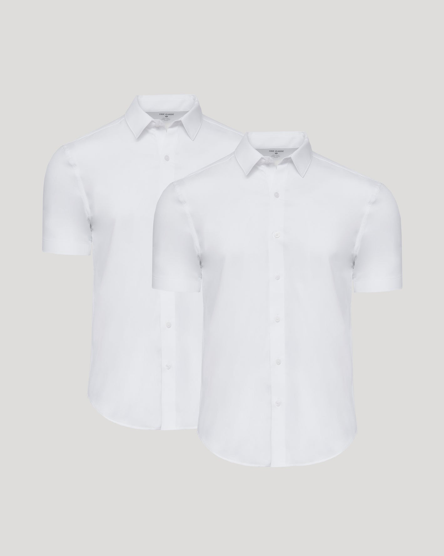 All White Short Sleeve Performance Dress Shirt 2-Pack displayed side by side.