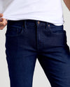 Indigo Rinse Slim Authentic Denim Jeans with belt loops and front pockets.