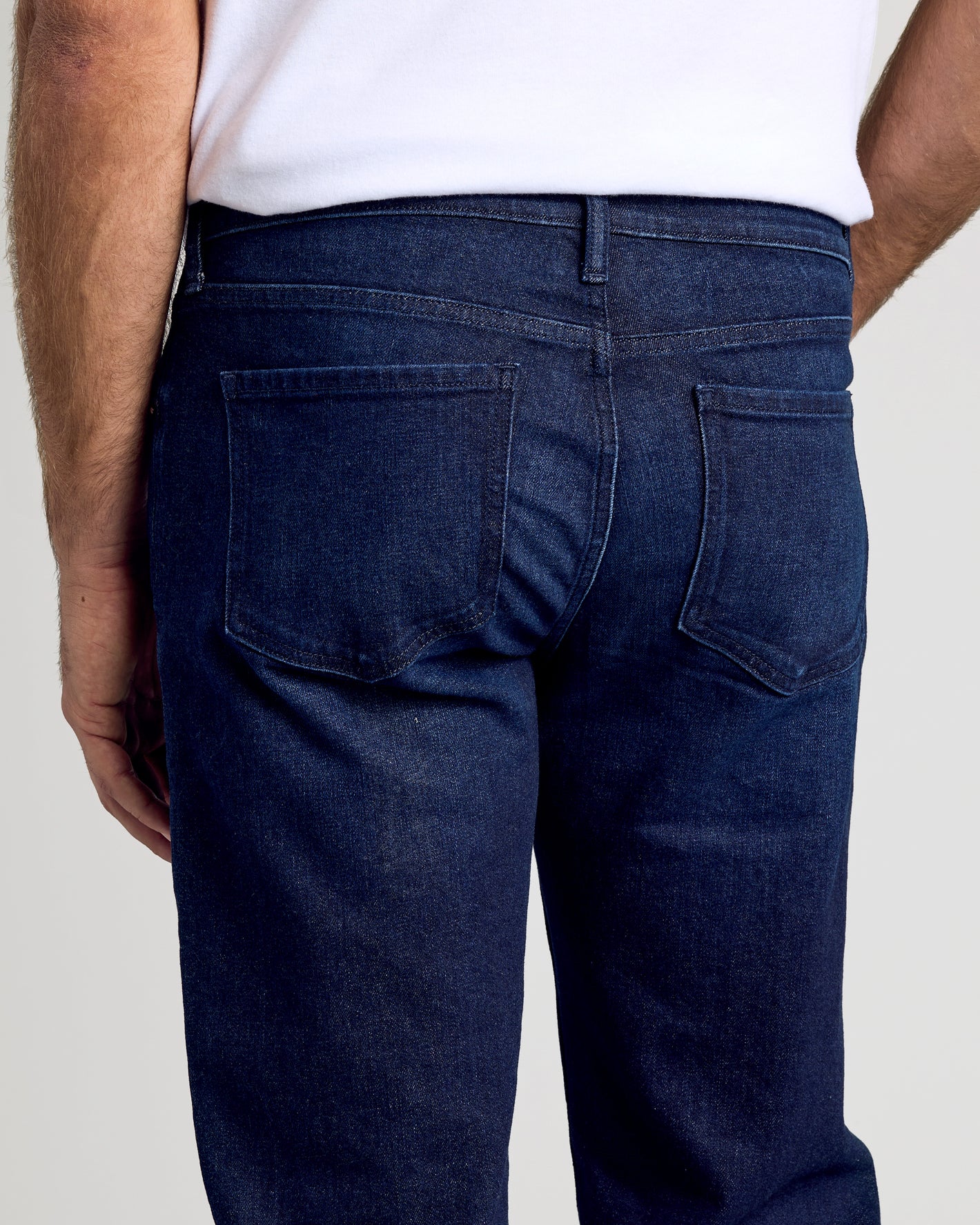 Rear view of Indigo Rinse Straight Authentic Denim Jeans showcasing back pockets.