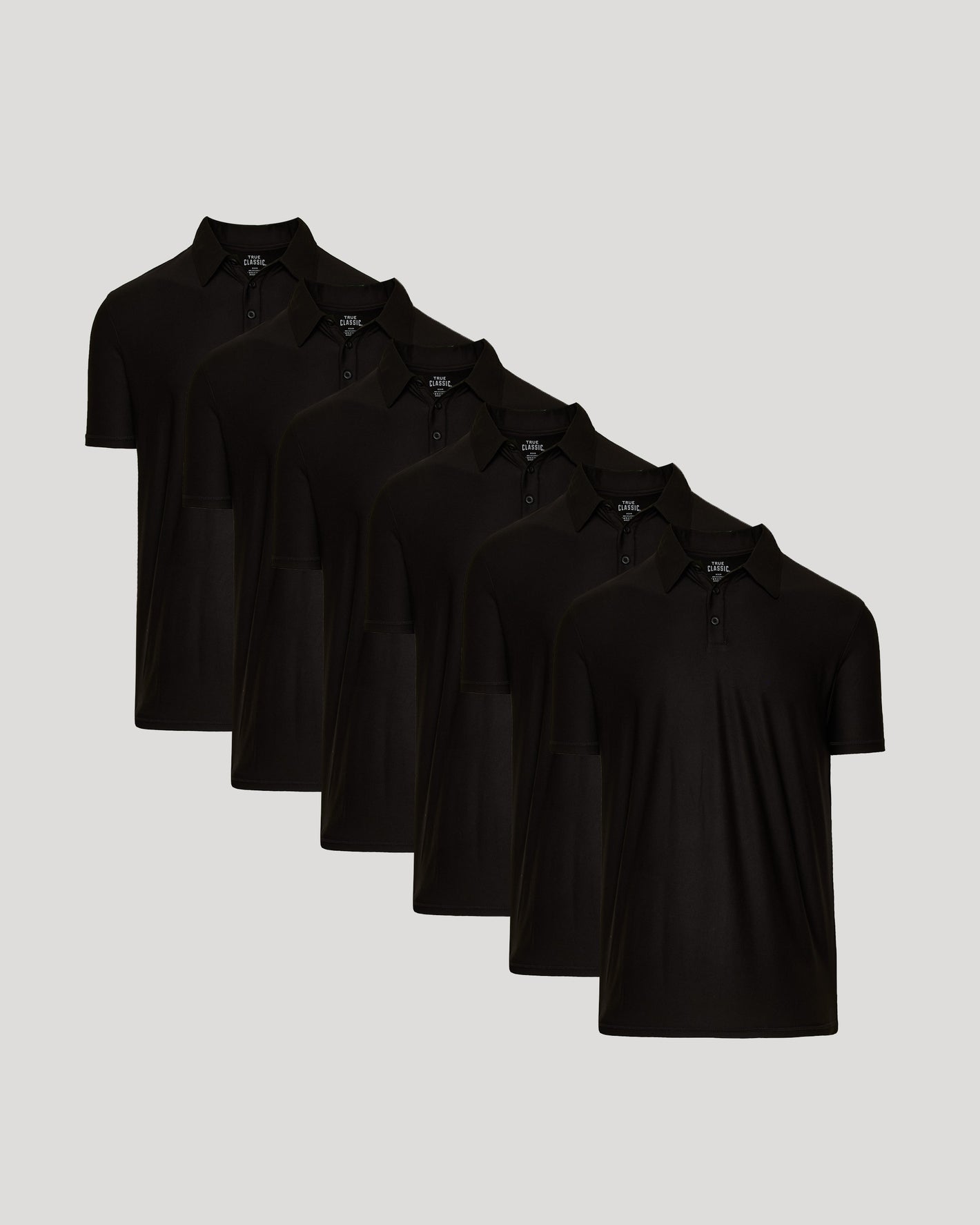 Black Active Polo 6-Pack with collars and button placket on gray background.