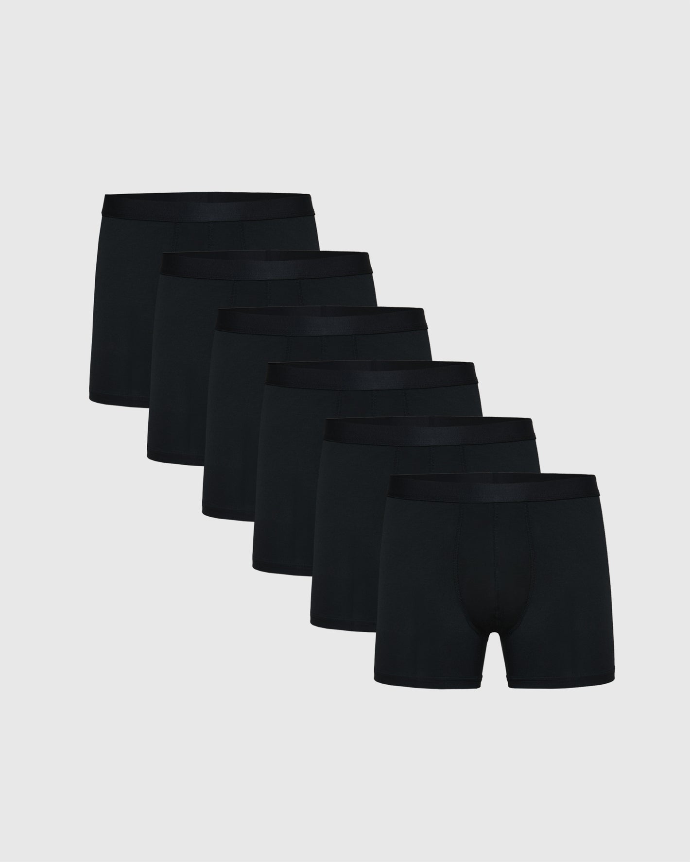 Black Boxer Trunks 6-Pack, staggered display, elastic waistband, flyless design.