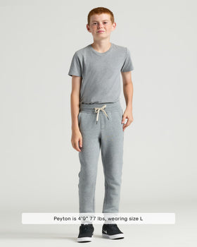 Boy wearing Boys' Black & Medium Heather Gray Fleece Joggers.