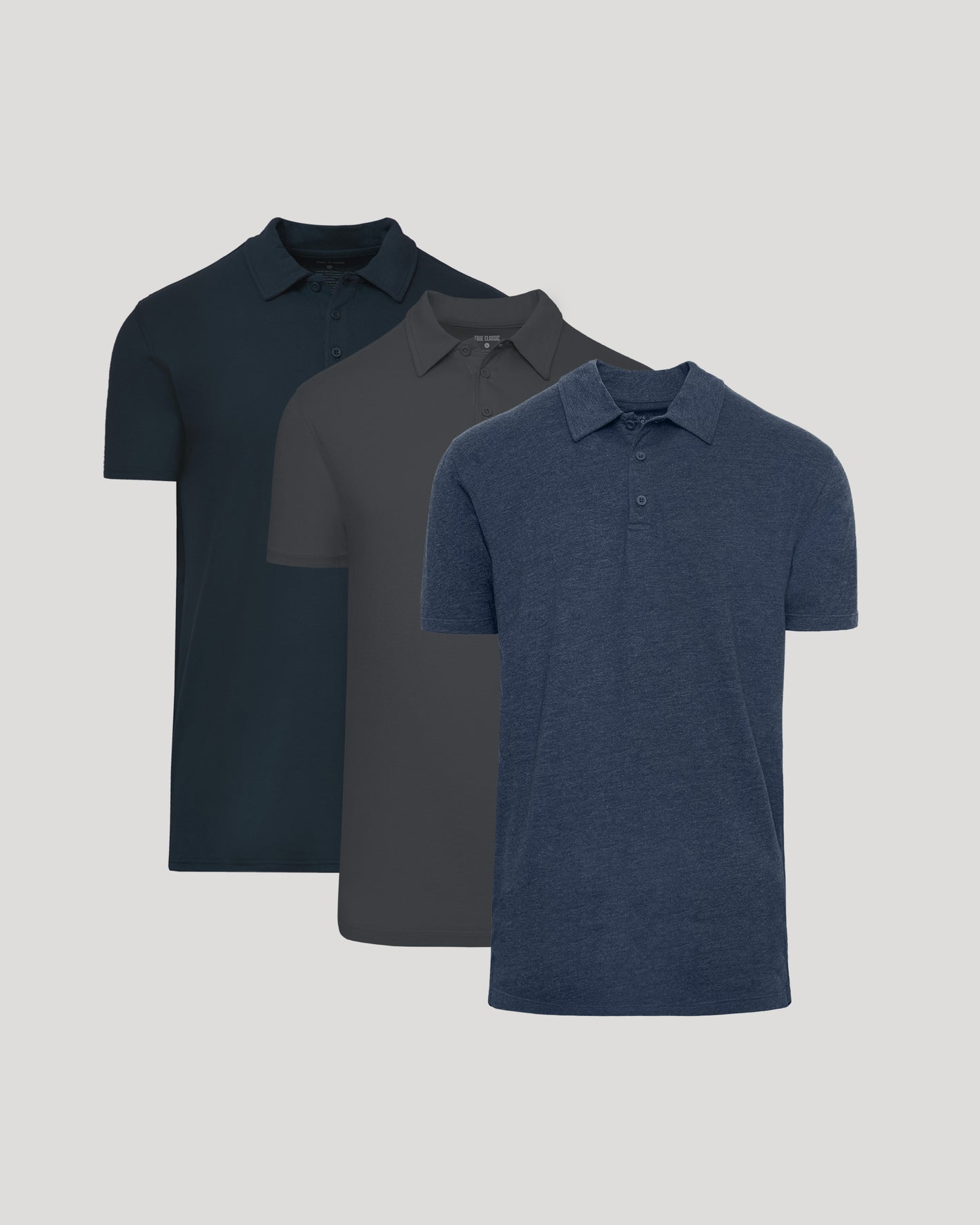 Three dark-toned The Staple Tall Classic Polo shirts.
