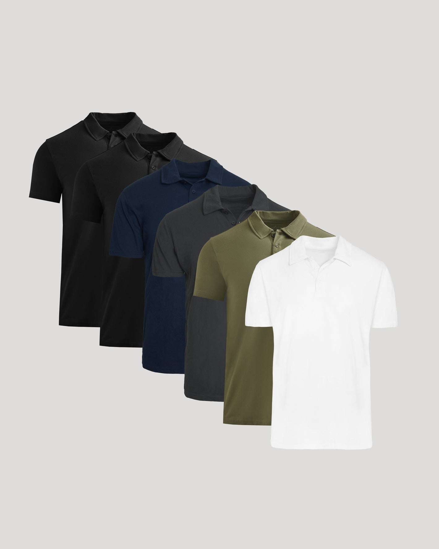 Five polo shirts in black, navy, gray, green, and white on a light gray background