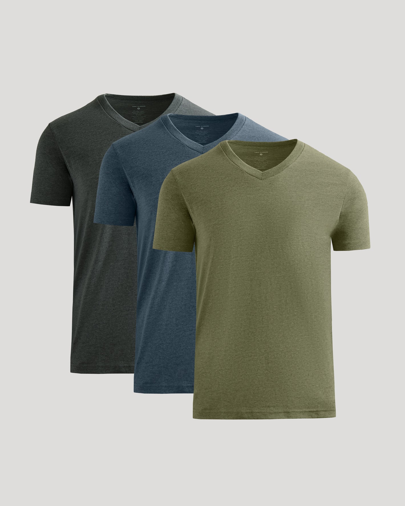 Three V-neck t-shirts in black, blue, and green on a light gray background