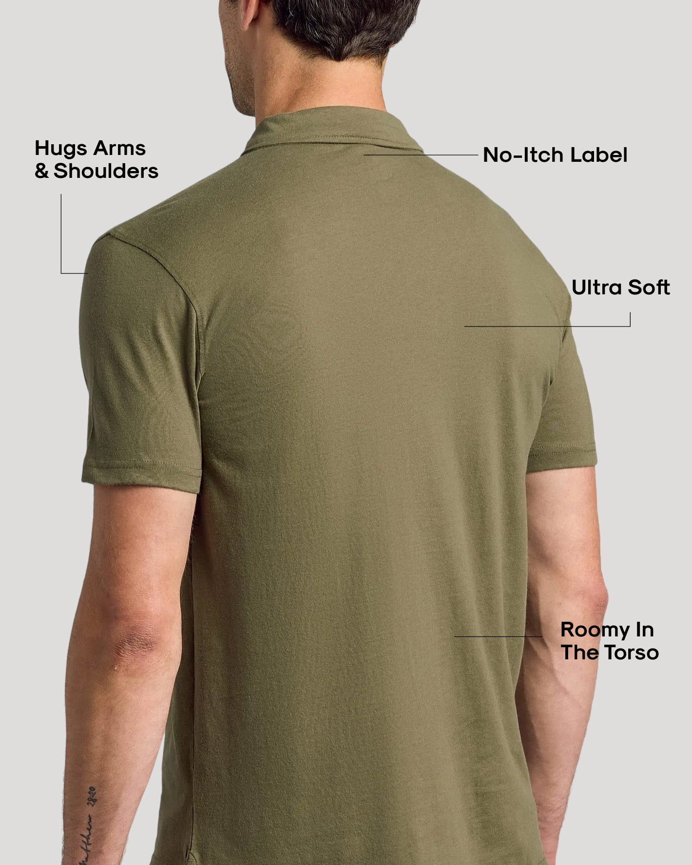 Man wearing Military Green Classic Polo, highlighting snug fit at shoulders, soft fabric, and no-itch label.