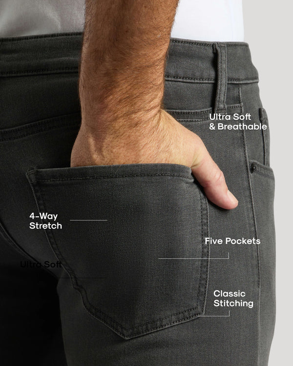 Gray Wash Slim Comfort Stretch Jeans with hand in back pocket.