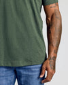 Dark Heather Olive Classic Crew Neck on tattooed arm and torso.