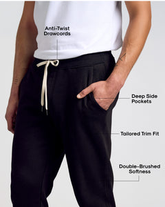 True ClassicMan wearing Black Fleece French Terry Joggers showcasing features: anti-twist drawcords, deep pockets, tailored trim, double-brushed softness.