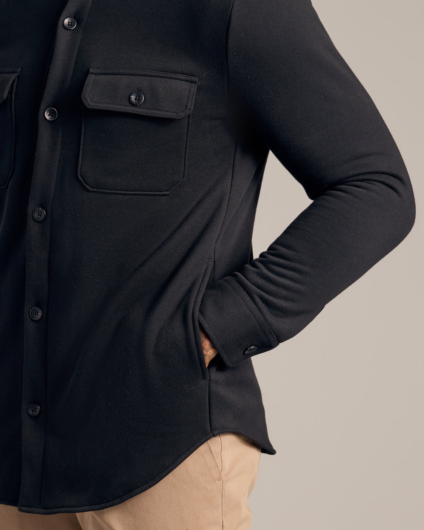 Black Fleece Shirt Jacket with chest flap pockets and buttoned cuffs.