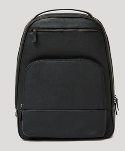 True ClassicPremium Leather Backpack with pebbled texture, zippered compartments, and top handle.