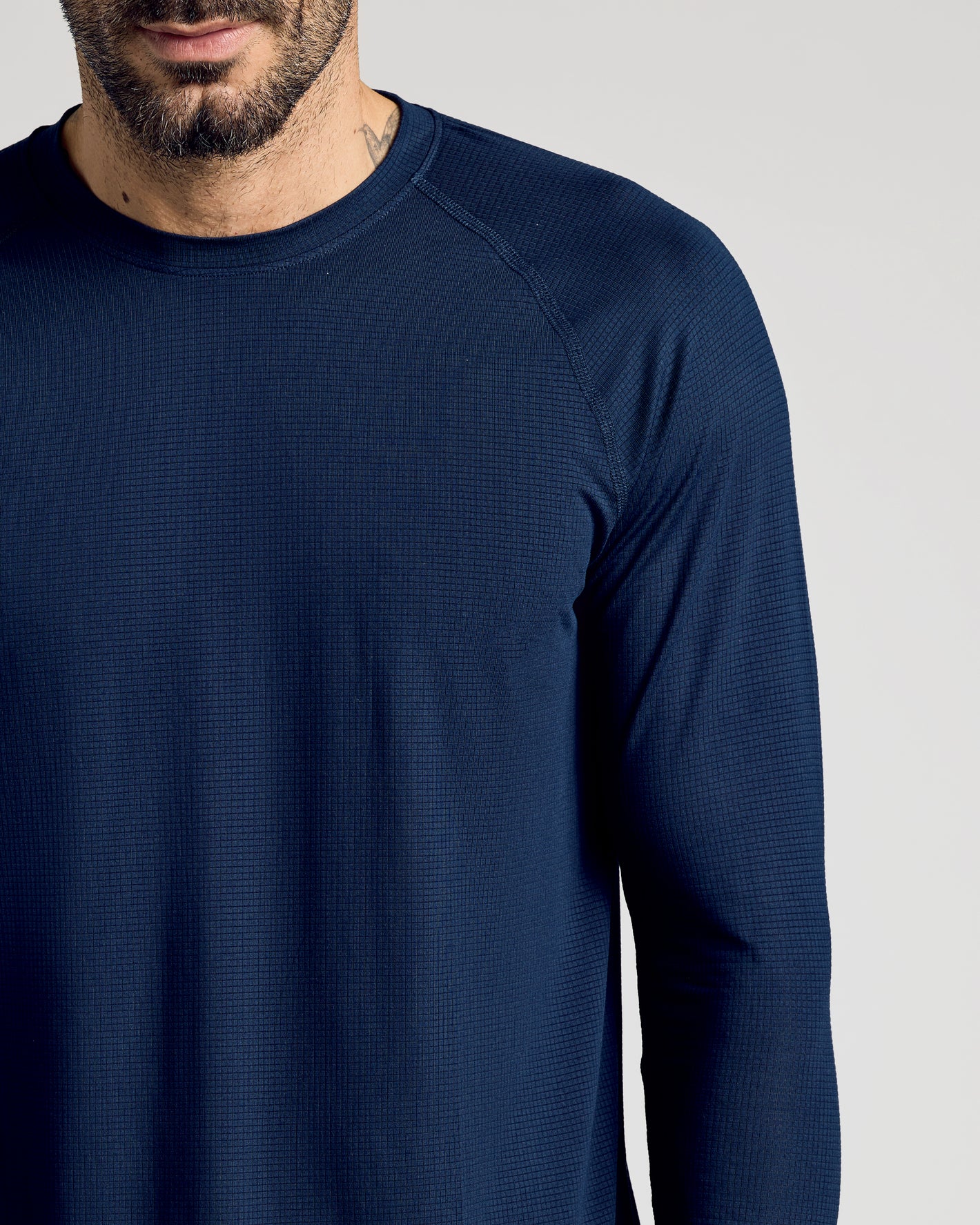 Navy Long Sleeve Active Mesh Crew worn by a bearded man.