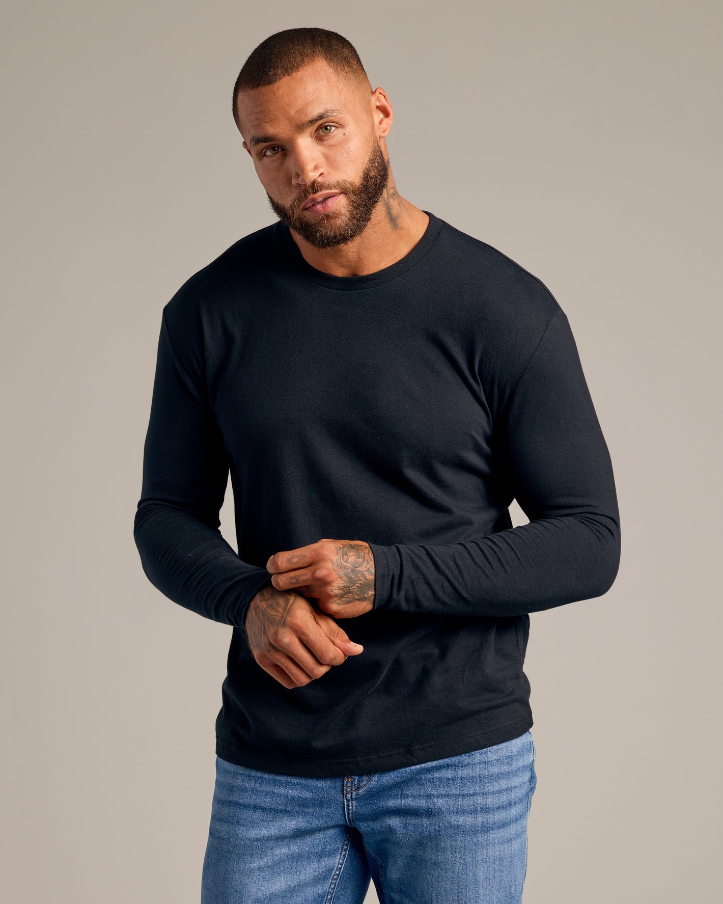 Male model wearing Try 1 Of Everything 5-Pack black long-sleeve crew-neck.