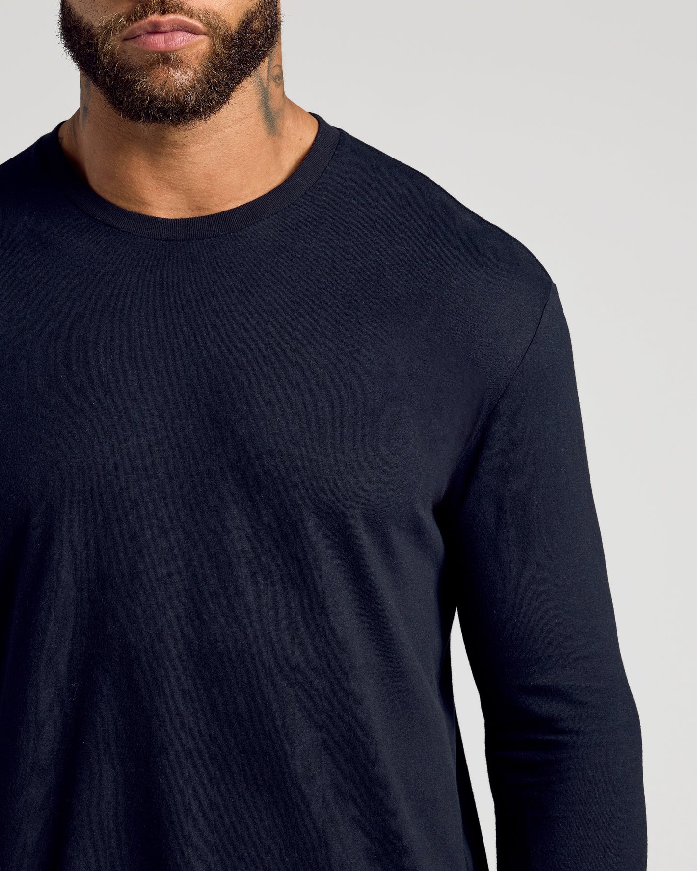 Man wearing Standard Long Sleeve Crew 3-Pack shirt, showcasing fit and style.