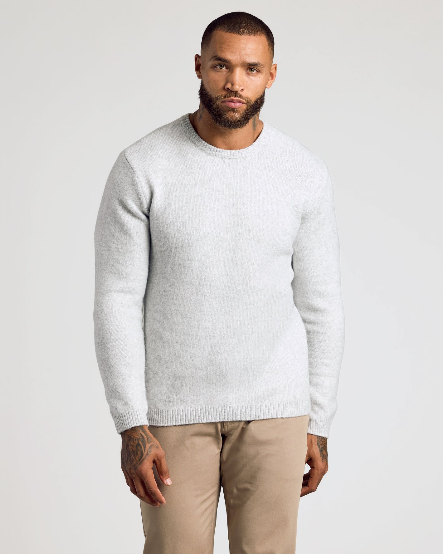 Light Heather Gray Marled Crew Neck Sweater with snug fit and tattoos.