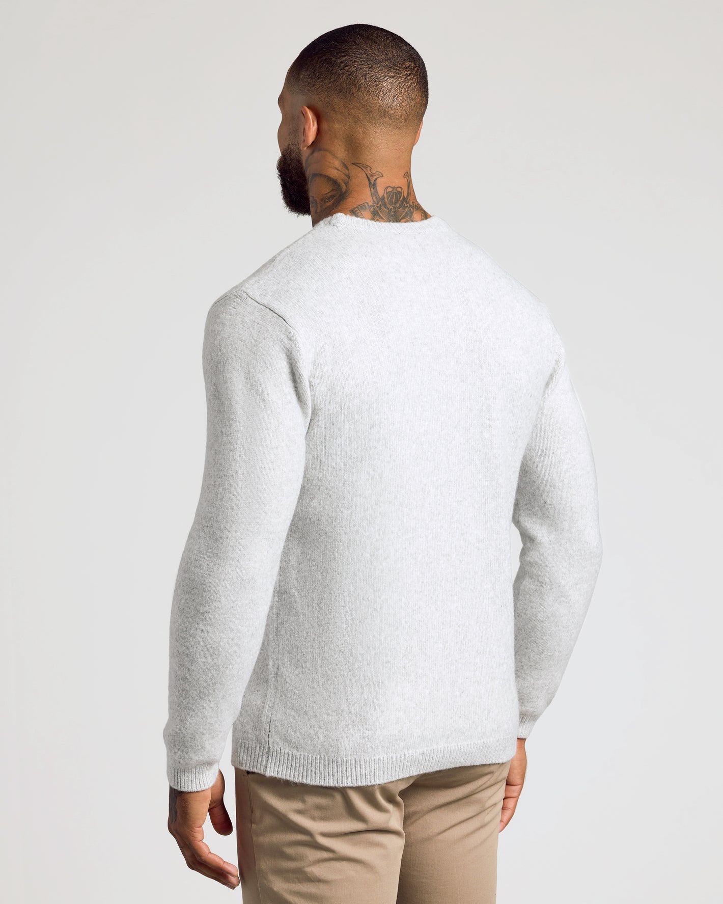 Light Heather Gray Marled Crew Neck Sweater worn by man, back view.