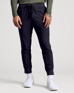True ClassicBlack Active Training Joggers with elastic waist, ribbed cuffs, and sneakers.