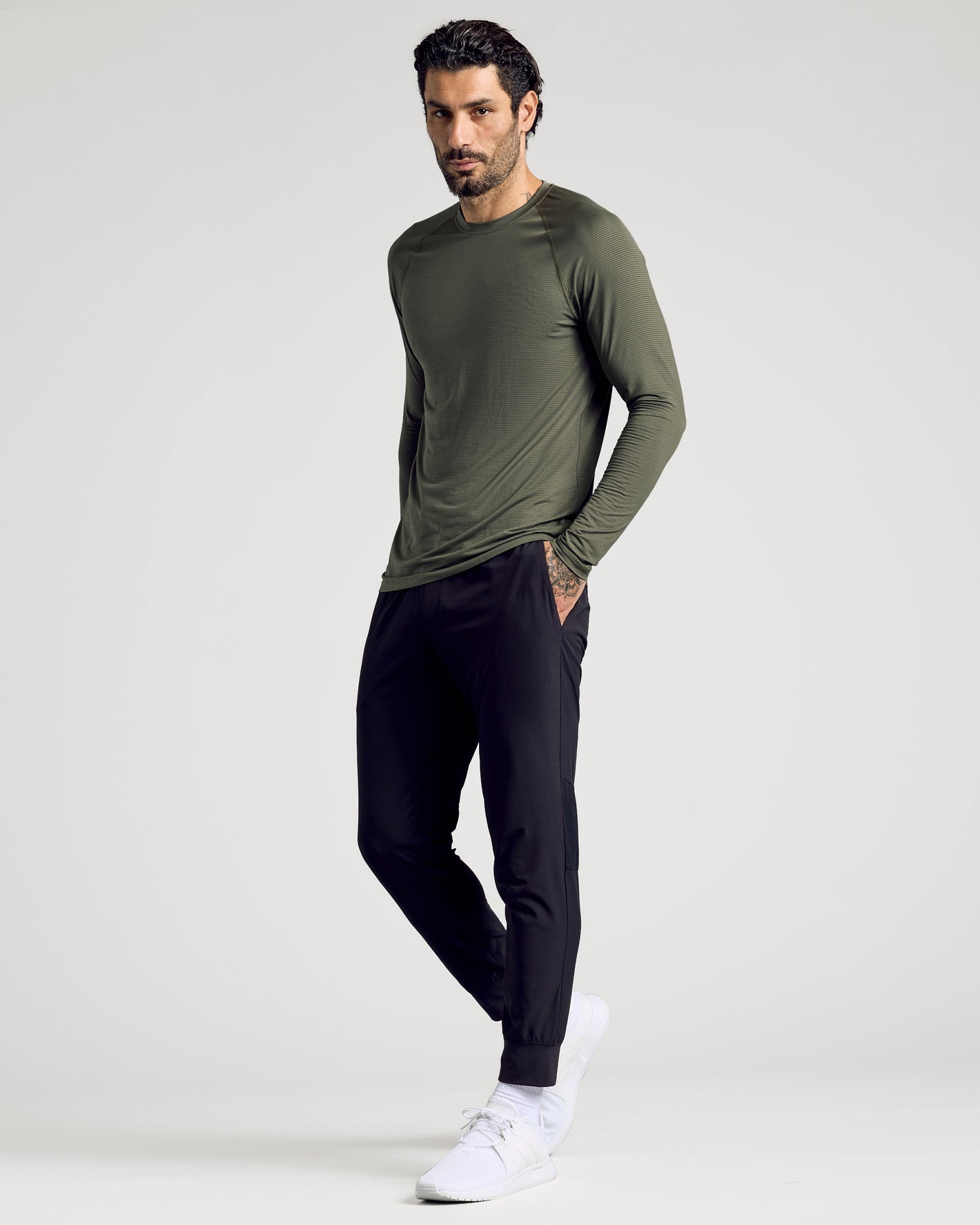 Man wearing Black Active Training Joggers in a relaxed, sporty pose.