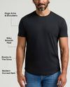 Man wearing a black Pima Cotton Blend Curved Hem Crew 4-Pack shirt, highlighting a modern curved hem, roomy torso, silky smooth feel, and snug fit around arms and shoulders.