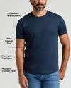 Man wearing a navy blue Pima Cotton Blend Curved Hem Crew 4-Pack t-shirt with a modern curved hem, silky smooth fabric, and a fit that hugs arms and shoulders while being roomy in the torso, paired with blue jeans.