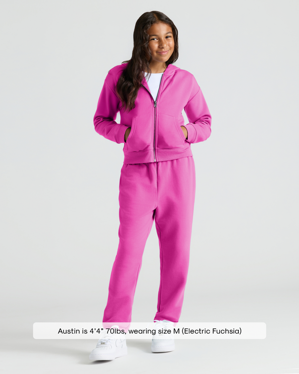 Child wearing Girls Electric Fuchsia Cropped Zip Hoodie & Relaxed Joggers.