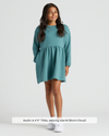 Girl in Girls Stormcloud Long Sleeve Fleece Dress, white sneakers.