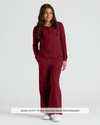 Girl in maroon waffle wide-leg pants with Henley top.