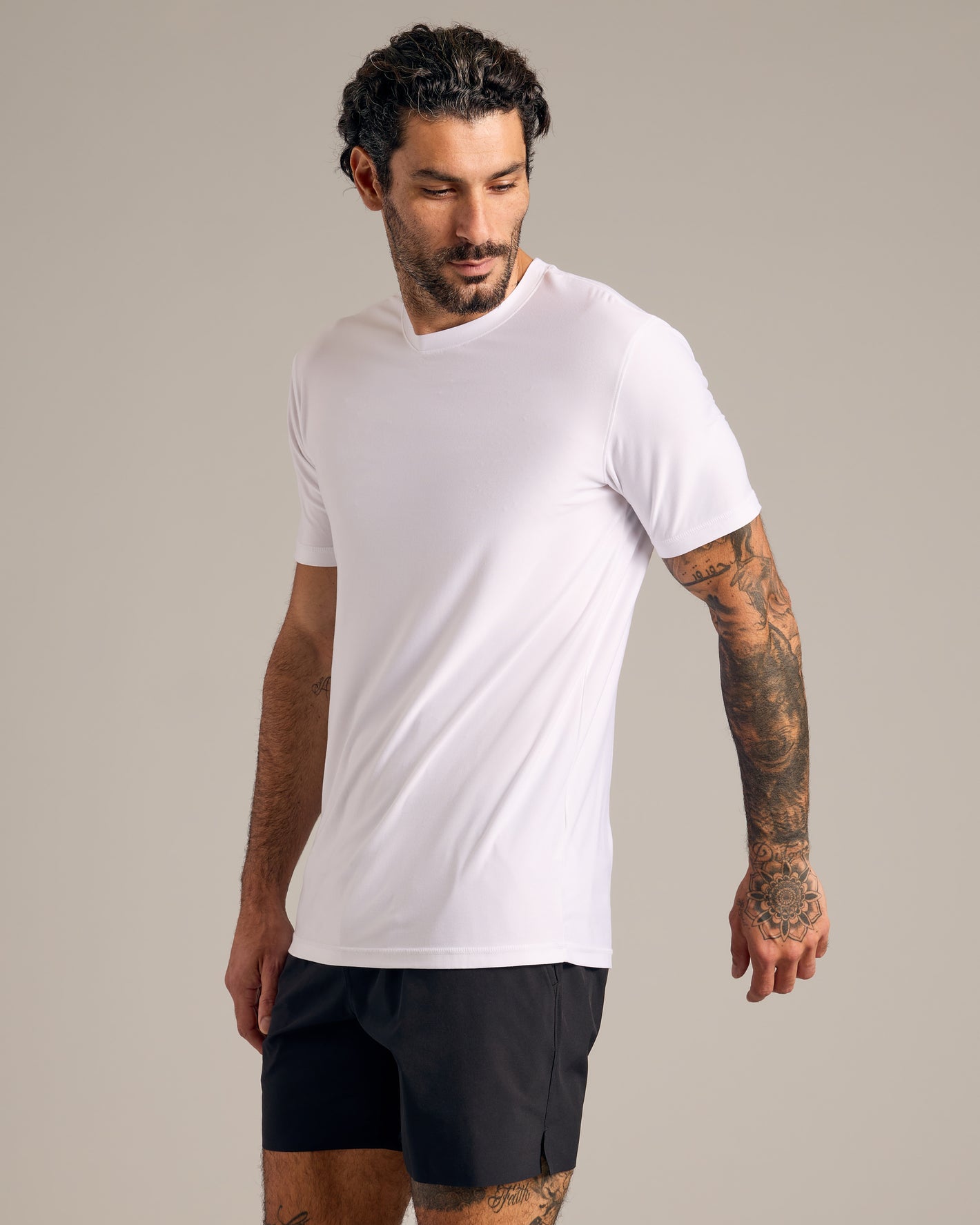 Man wears Heather Active and Classic Crew Neck Tee 6-Pack.