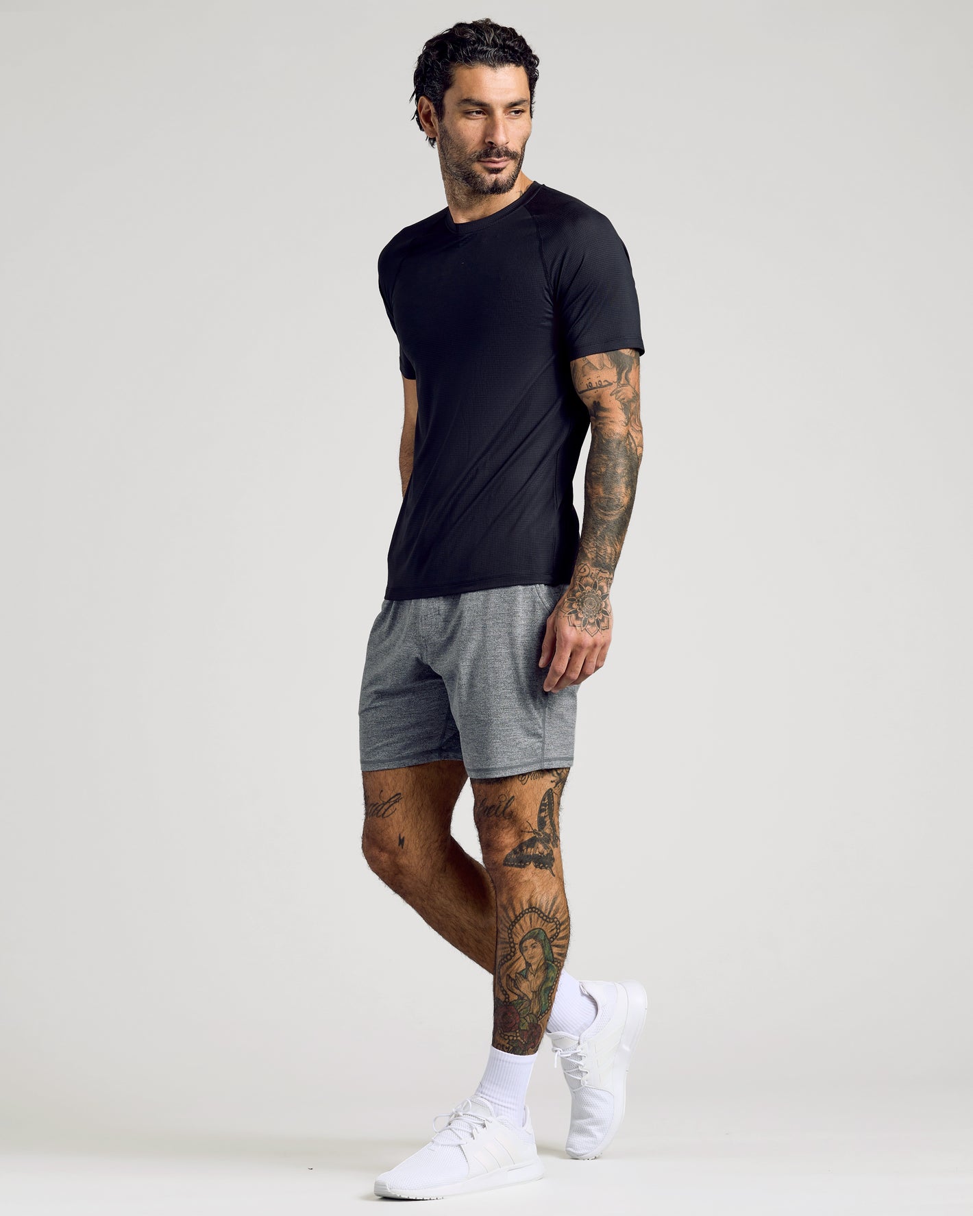 Male model wearing Black & Navy Active Mesh Crew 6-Pack shirt, tattoos visible.