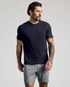 Man wearing Black & Navy Active Mesh Crew 6-Pack, tattoos visible, relaxed stance.