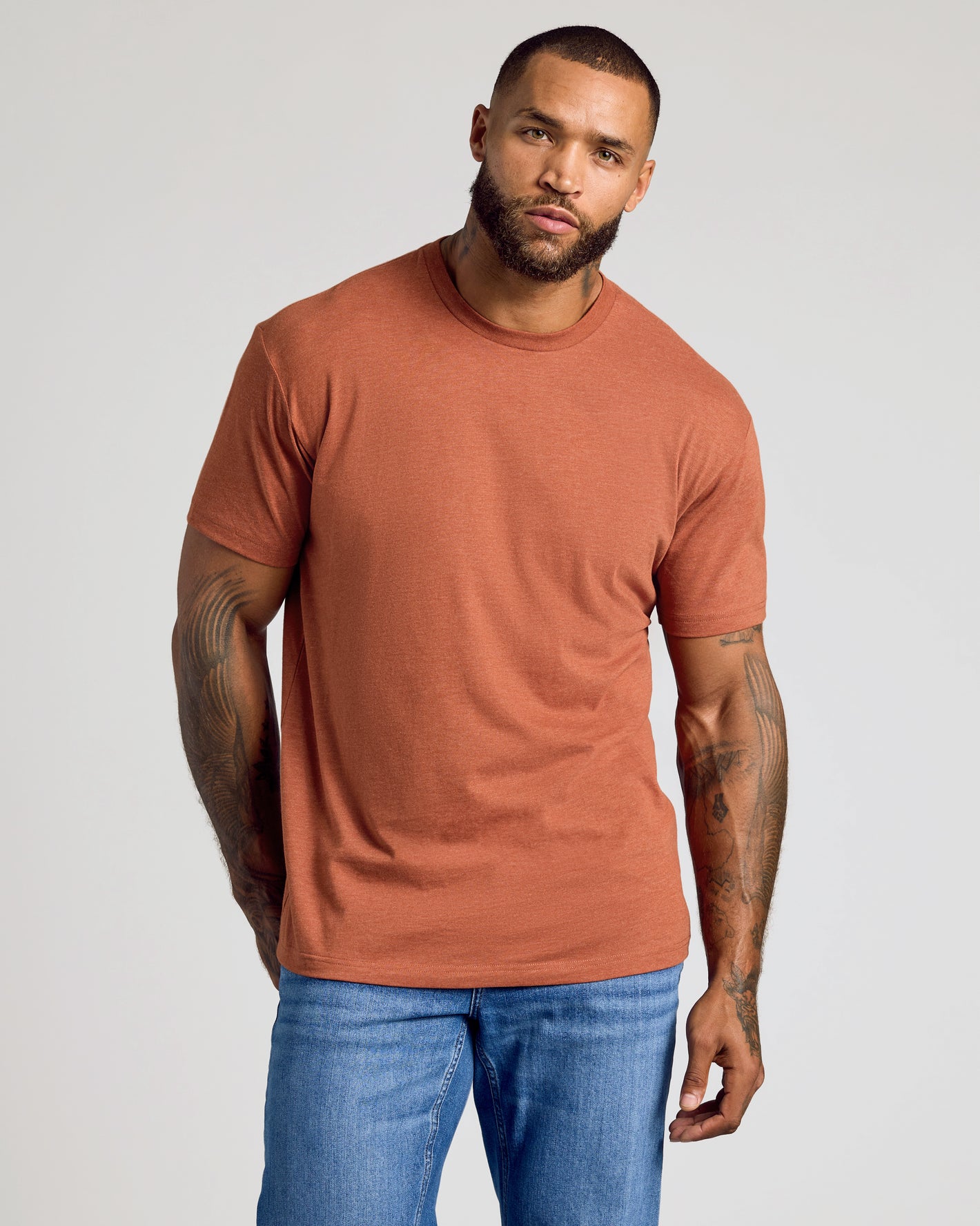 Heather Gingersnap Classic Crew Neck worn by tattooed man in jeans.