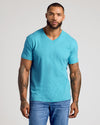 Man wearing Dark Heather Harbor Classic V-Neck, showcasing tattoos and fitted design.